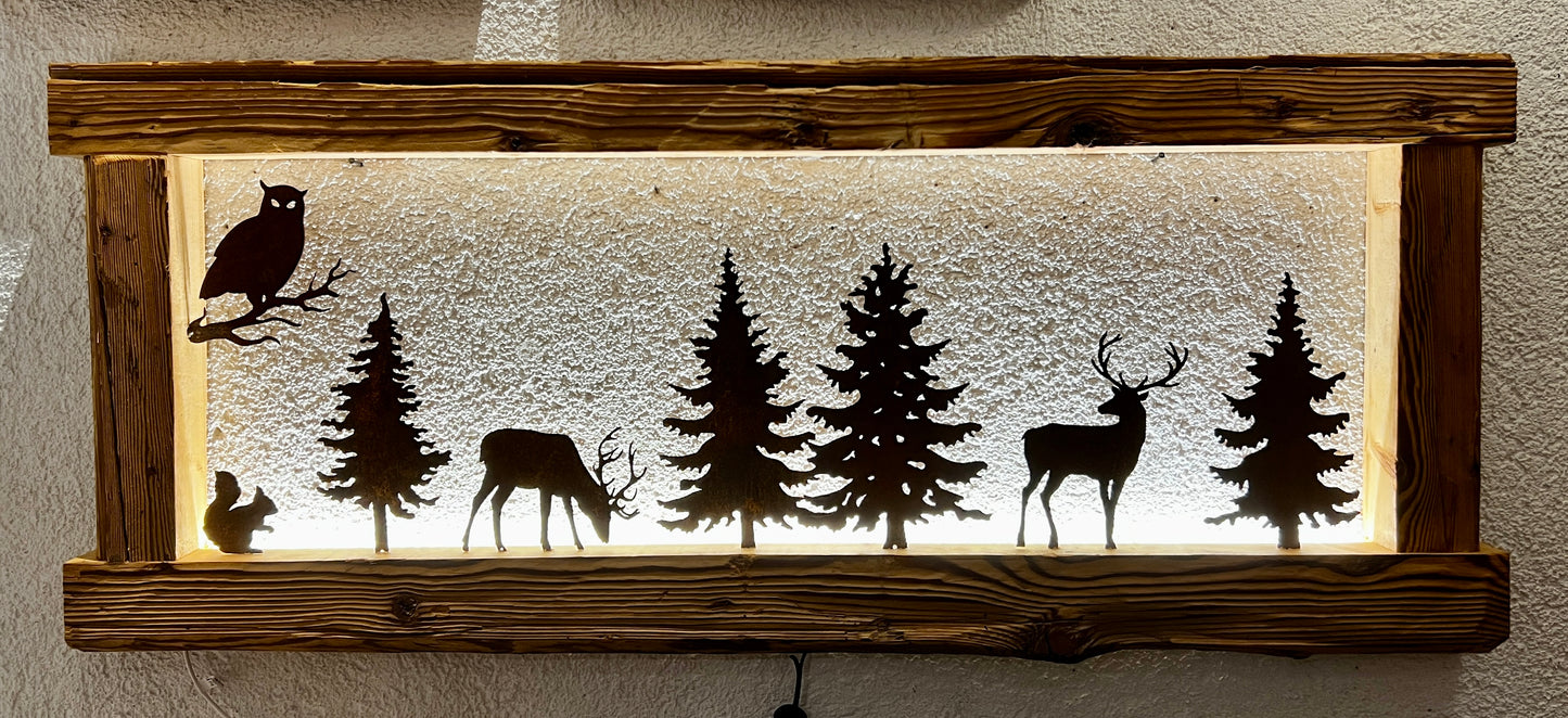 Cornice con led e sagome di animali della foresta